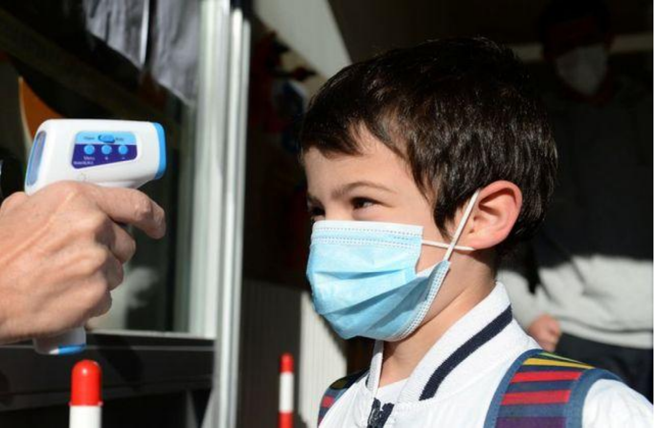 child gets temperature taken